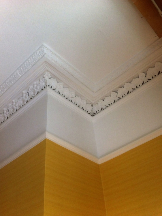 Wallpapering throughout, woodwork, cornices and friezes.